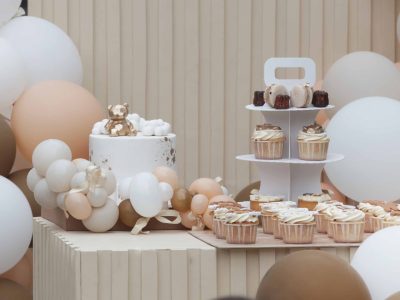 Elegant velvet chair and floral baby shower decorations Dubai for the mom-to-be