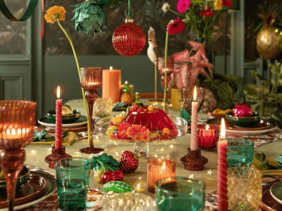 Corporate Christmas theme decoration with festive lights, Christmas tree, and red-gold decor setup