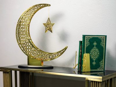 Ramadan crescent moon and star decoration with warm lights and Islamic theme