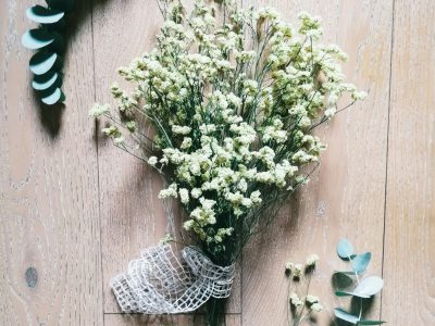 Sophisticated white lilies in a modern glass vase, perfect for minimalist Valentine's Day home or office decoration.