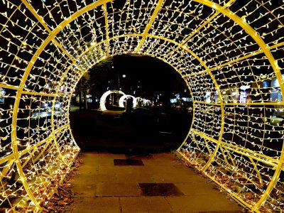Golden and blue LED festive light arches illuminating a pathway for a romantic Valentine's Day event in Dubai.