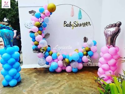 Blue themed baby boy shower decorations including personalized backdrops and cake tables in Dubai