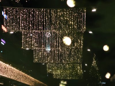 Luxury Dubai villa entrance transformed into a private light festival with warm white LED curtain lights and festive decor.